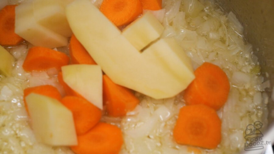 adding potatoes to pot