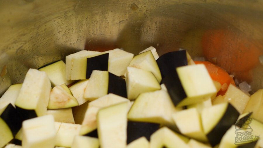 adding eggplant to pot