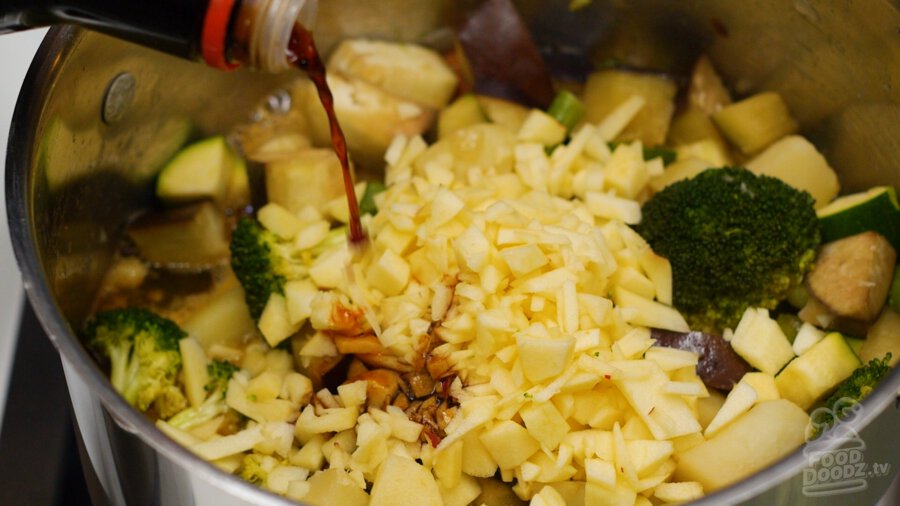 adding soy sauce to pot