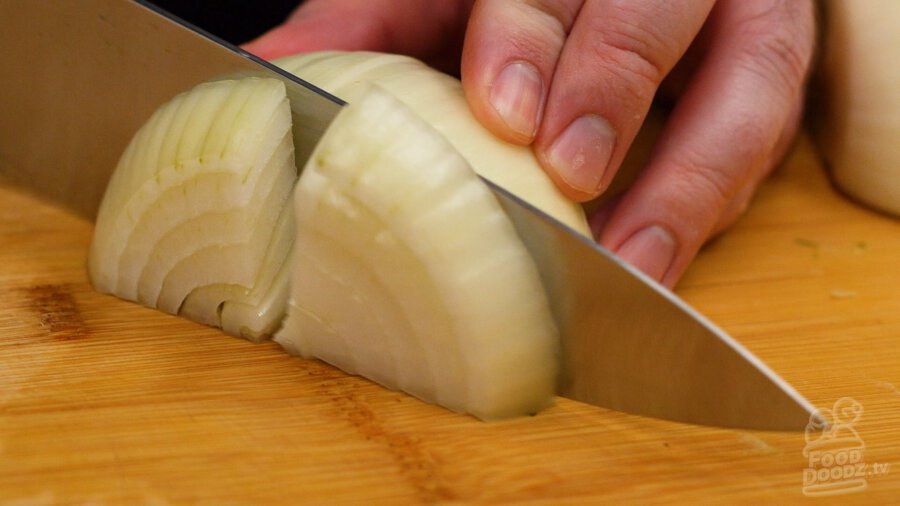 Slicing onion into large slices