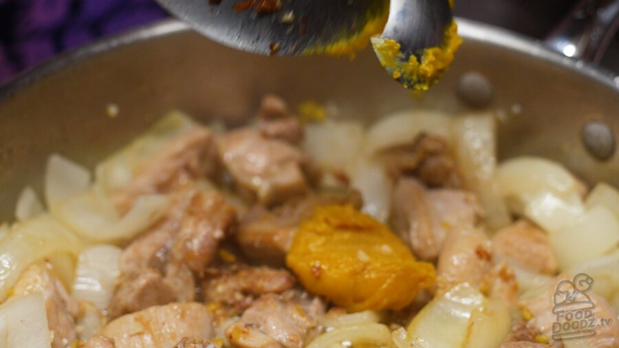 adding chicken bouillon paste to pan