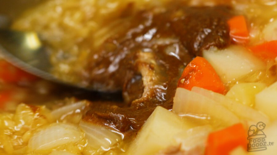 adding the curry roux to the pan