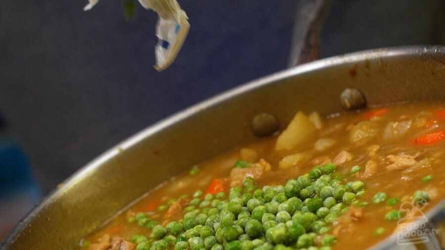 Adding frozen peas to pan