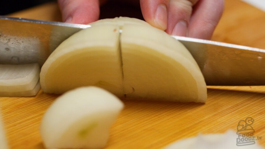 Slicing onion into large slices