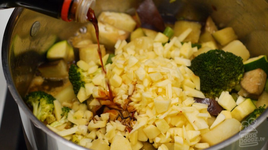 adding soy sauce to pot