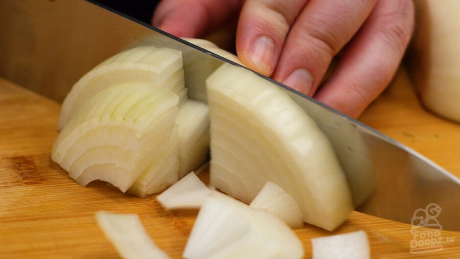 Slicing onion into large slices