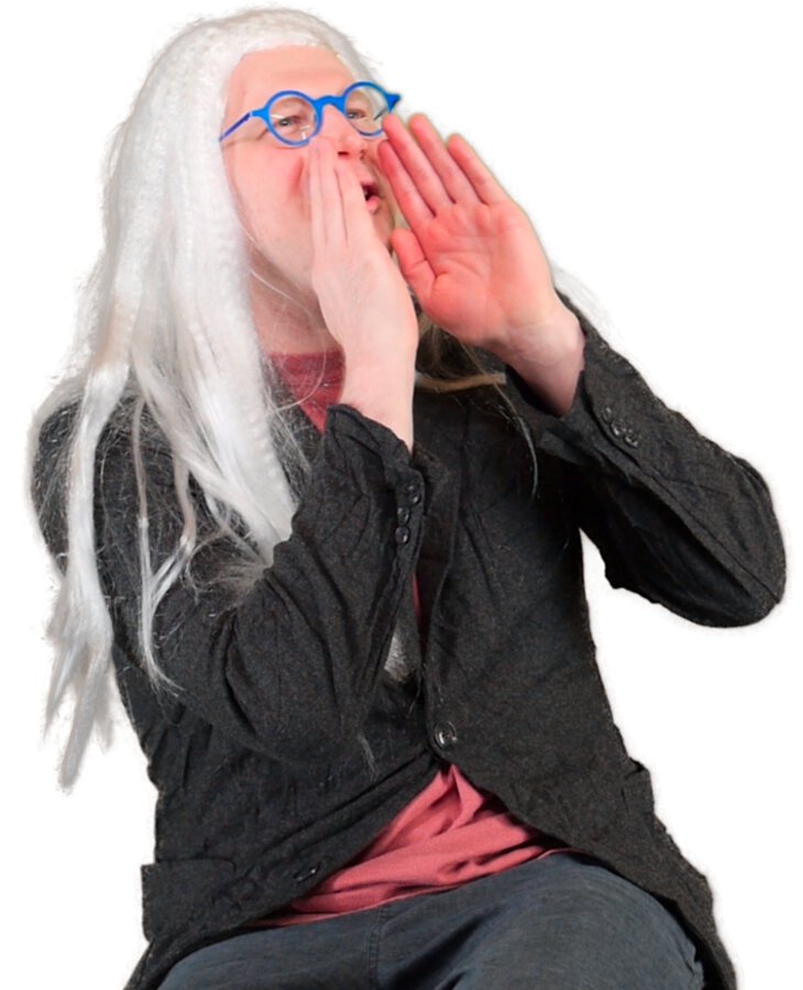 Austin dressed as bookstore owner from Portlandia with long white hair and suit jacket holding hands to face and yelling to the right