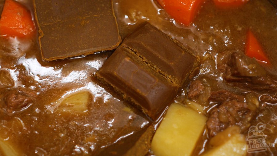 adding curry roux pieces to pressure cooker