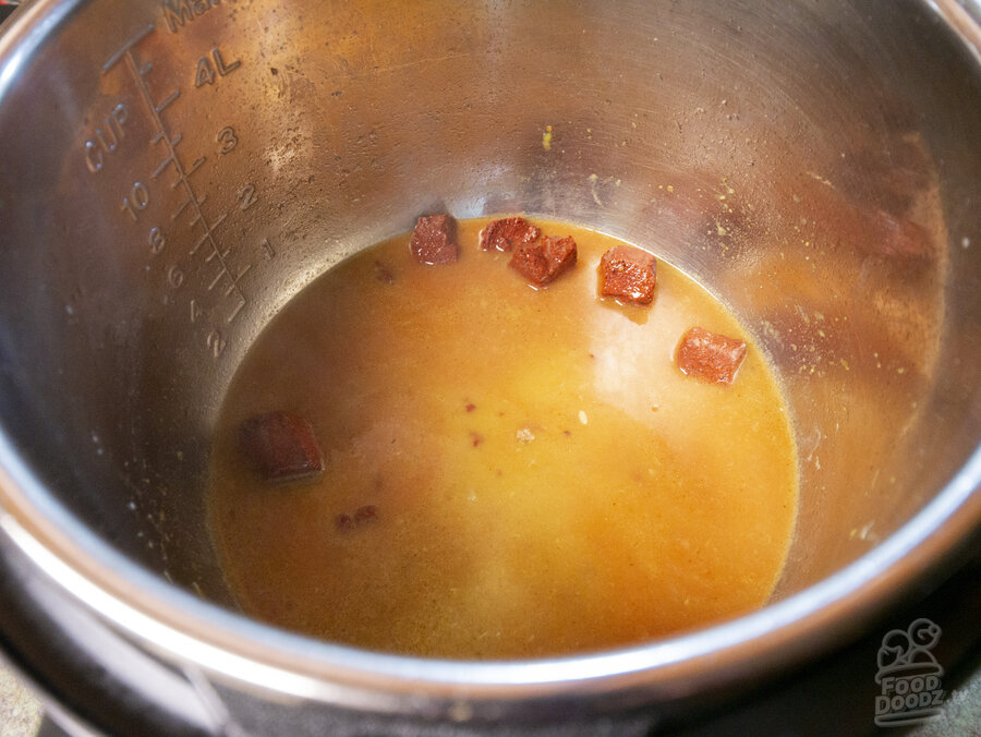 Orange juice, lime juice, and achiote paste added to pan